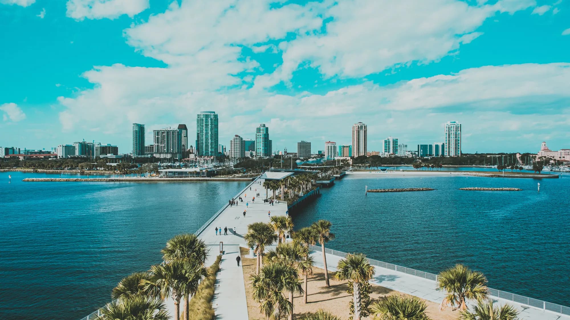 A Florida coastal city with its pier and palms, from above