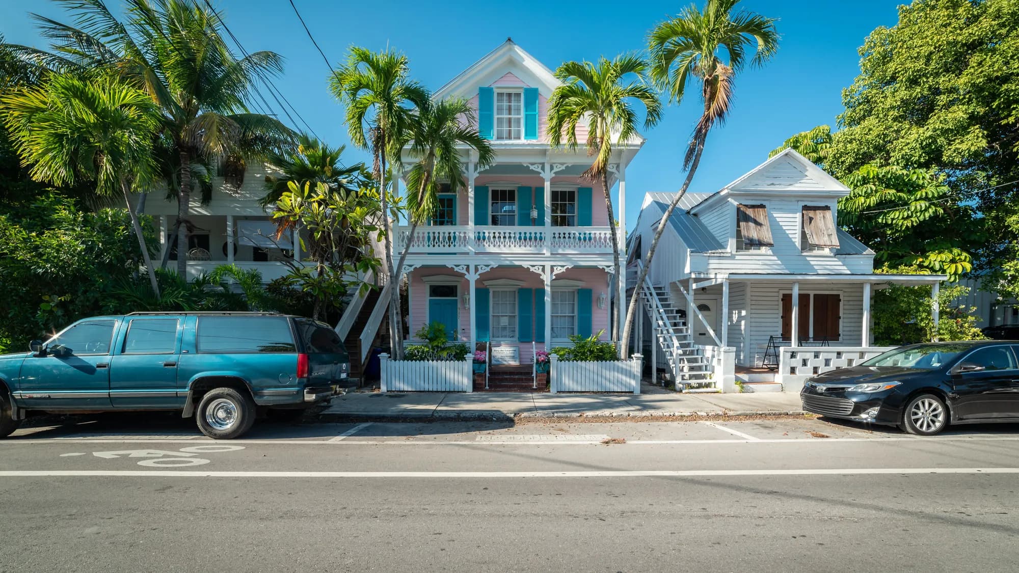 Historic houses and palms on a street in Key West, Florida