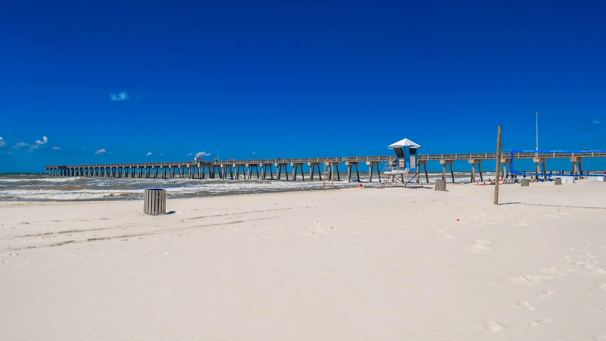 The pier and white sand at Panama City Beach, Florida