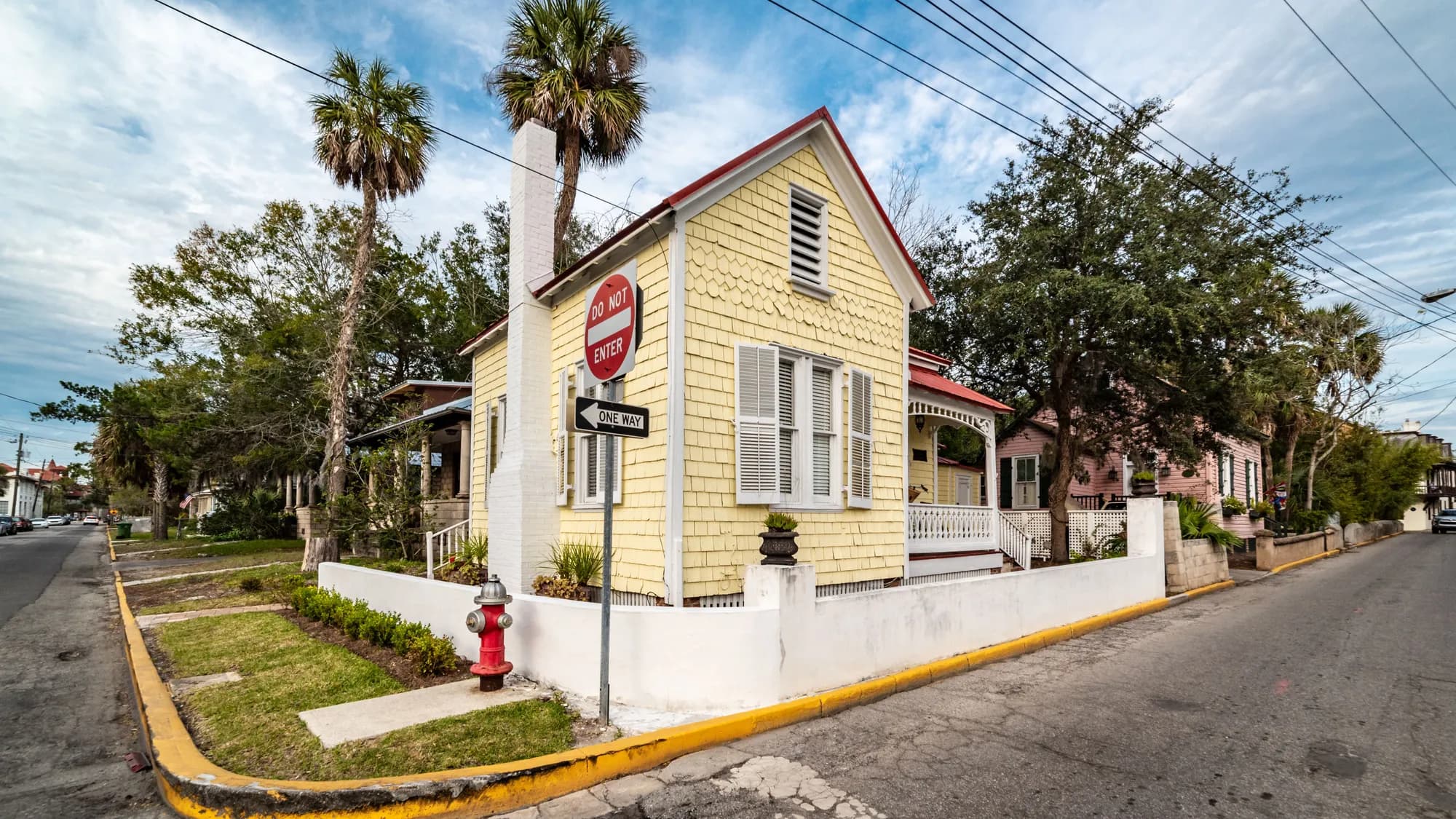 A yellow frame house on a corner lot in St. Augustine, Florida